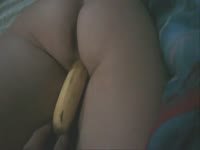 Sexy teen using banana as a dildo